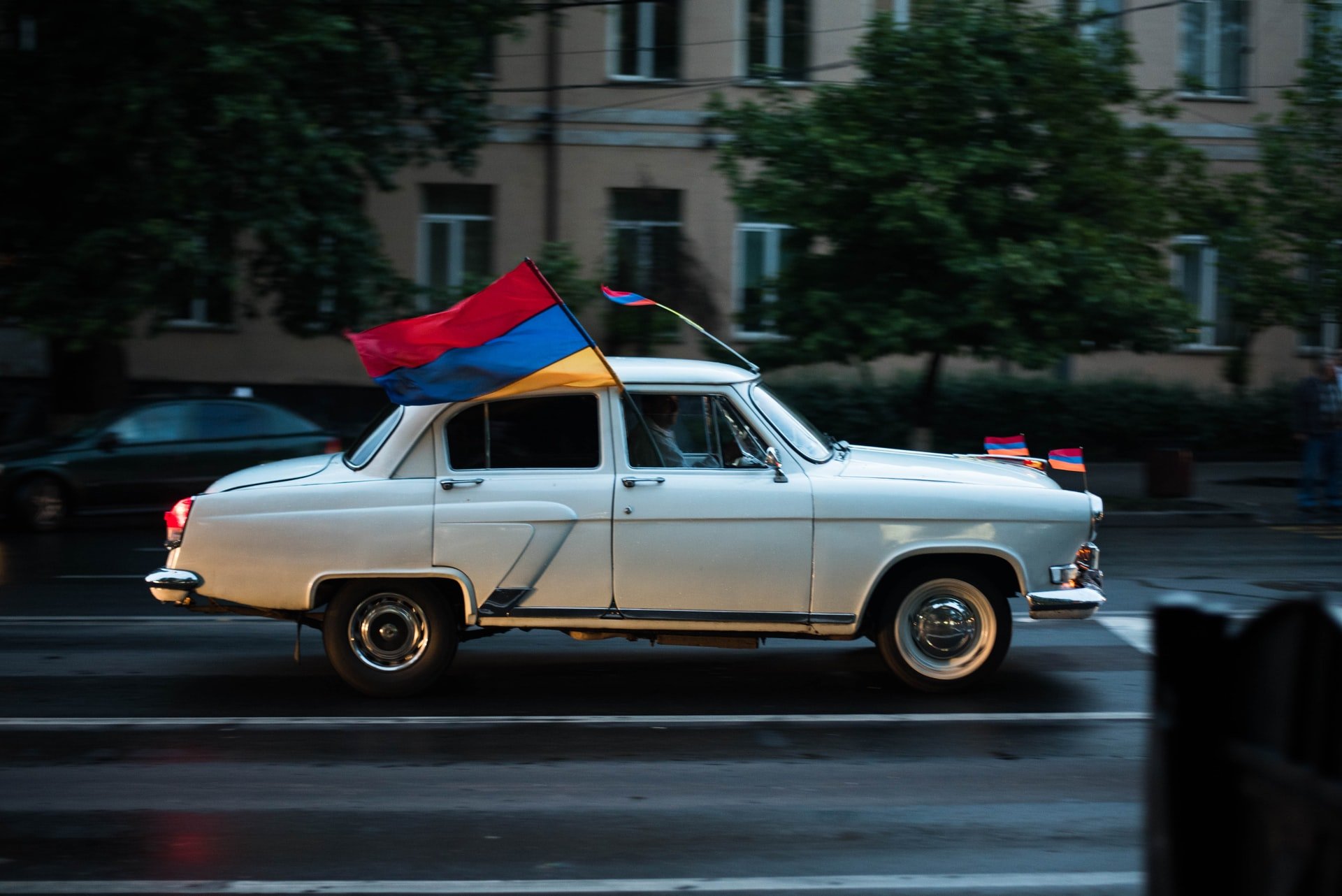 old car with armenian flags